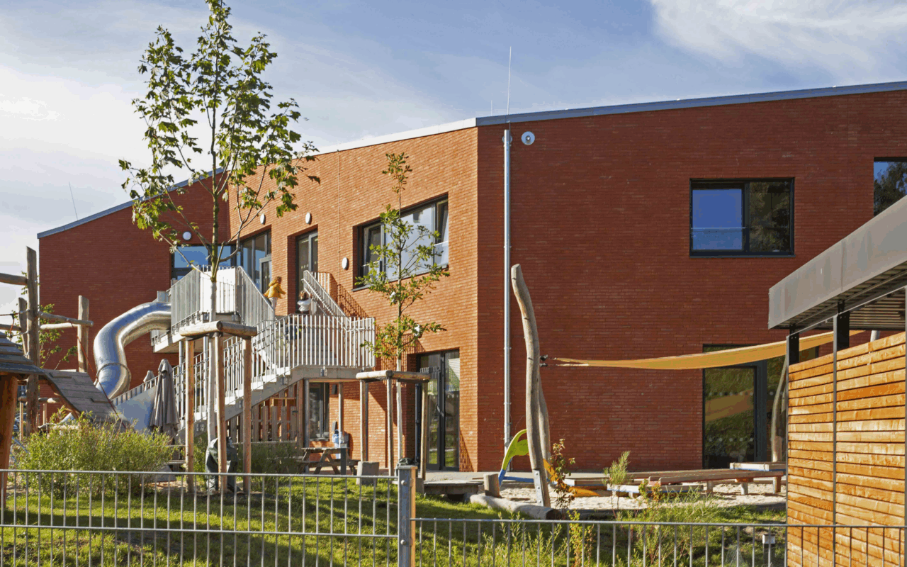 An external balcony on the upper floor leads to the outside via a staircase.